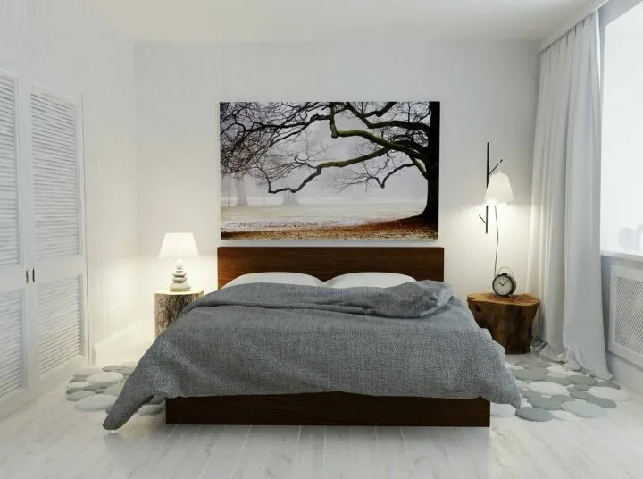 Минималистический дизайн спальни с картиной над кроватью